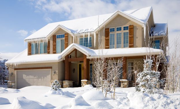 A beautiful rental property covered snow in winter - Express Capital Financing