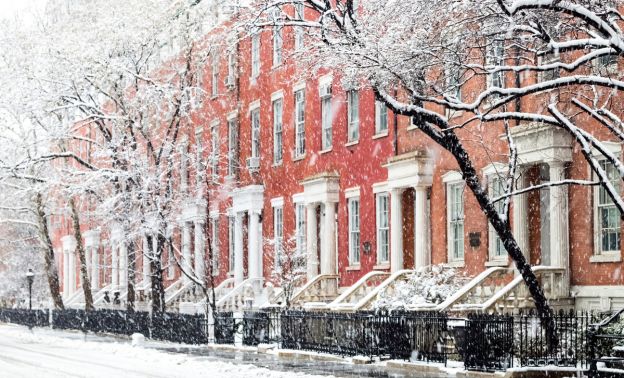 A New York residential street in winter during snowfall - Express Capital Financing