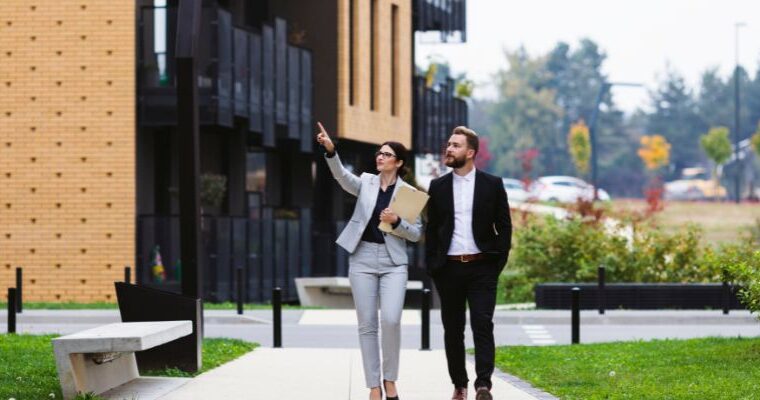 A property manager showing properties to her investor client - Express Capital Financing
