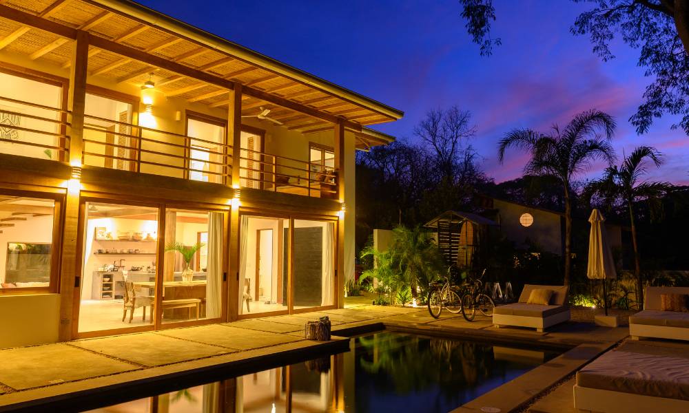 A rental property with a pool at night in the US - Best Rental Markets for Spring - ECF