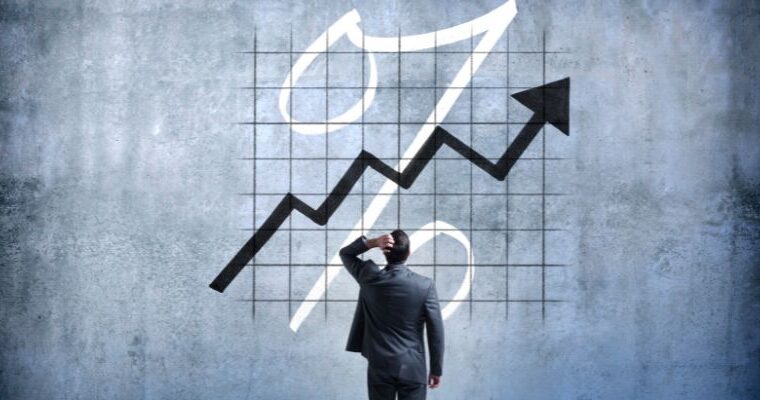 A man staring at a rising graph - ECF