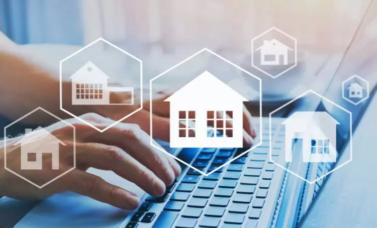typing on a keyboard with overlaying houses - buy and hold real estate property