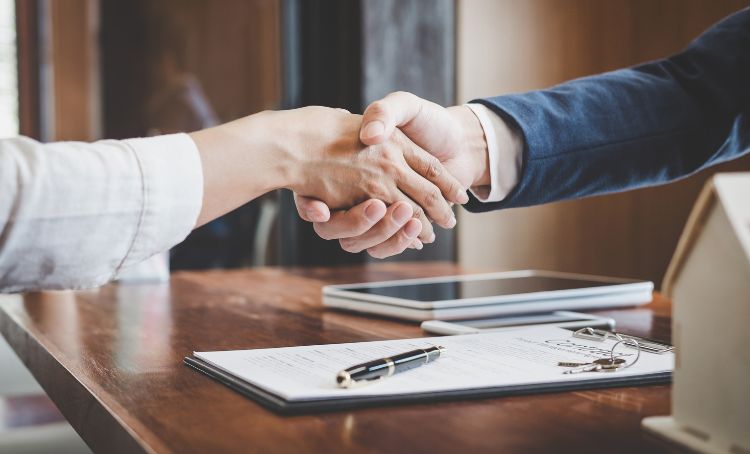 two people shaking hands - commercial real estate