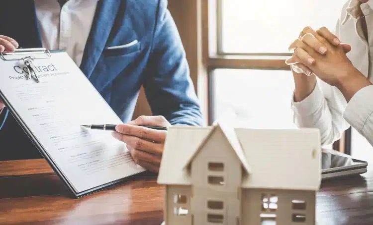 a pen pointing at a contract - hard money lender