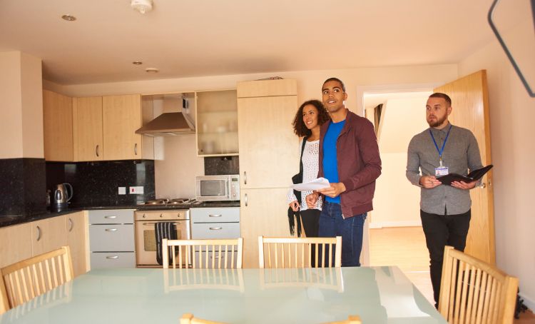 a couple looking at a rental property - rental property