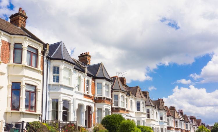 a row of houses on a street - rental property