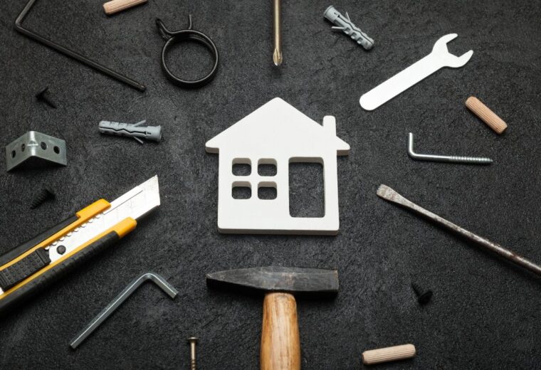 A small white house icon surrounded by various tools - Express Capital Financing