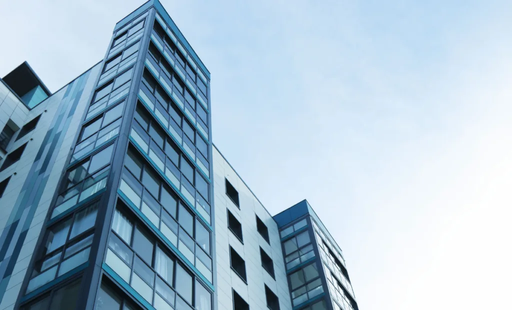 An upward view of a large office building - Express Capital Financing