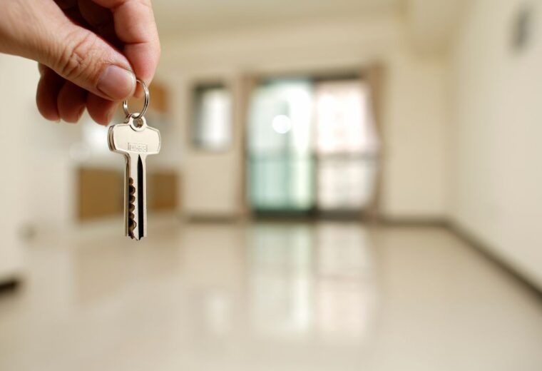 A property investor holding the keys to a rental property - Express Capital Finance