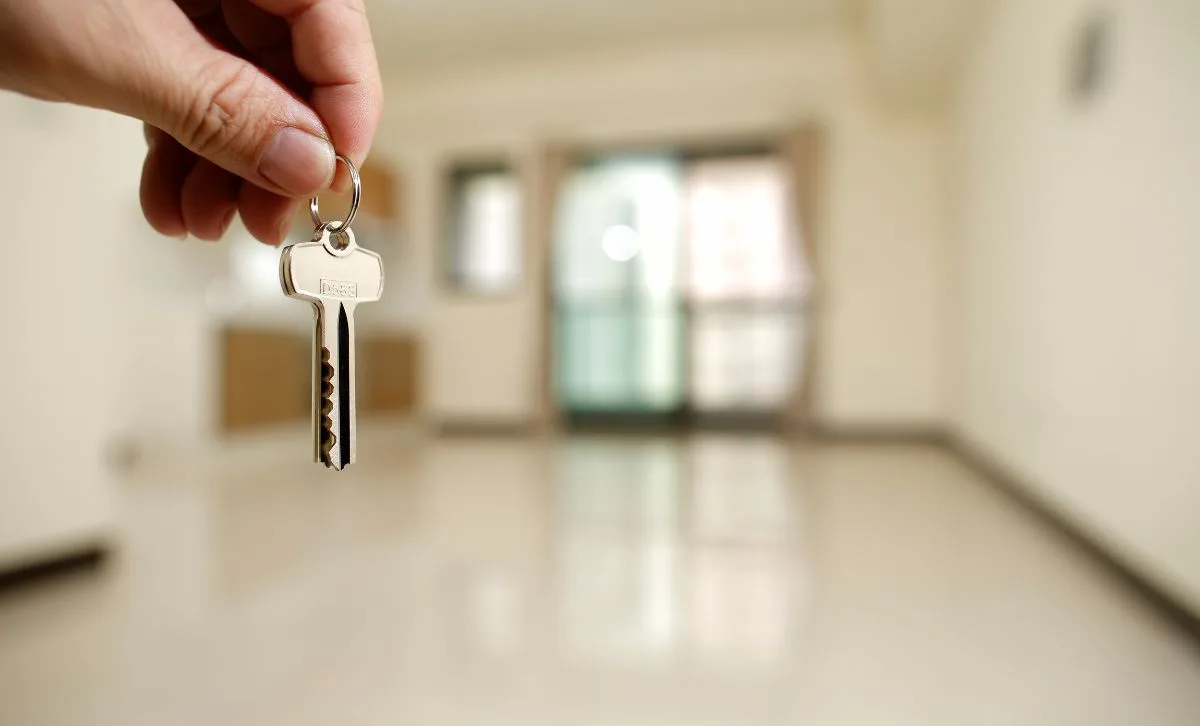 A property investor holding the keys to a rental property - Express Capital Finance