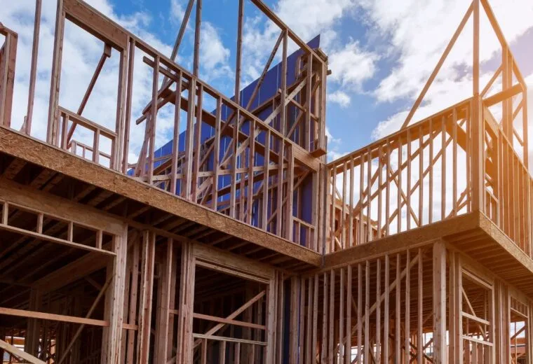 The wooden frame of an under-construction house - Express Capital Financing