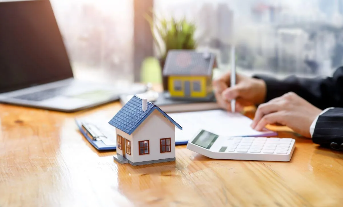 A property investor signing a DSCR loan deal for a cash out refinance for a rental investment - Express Capital Financing