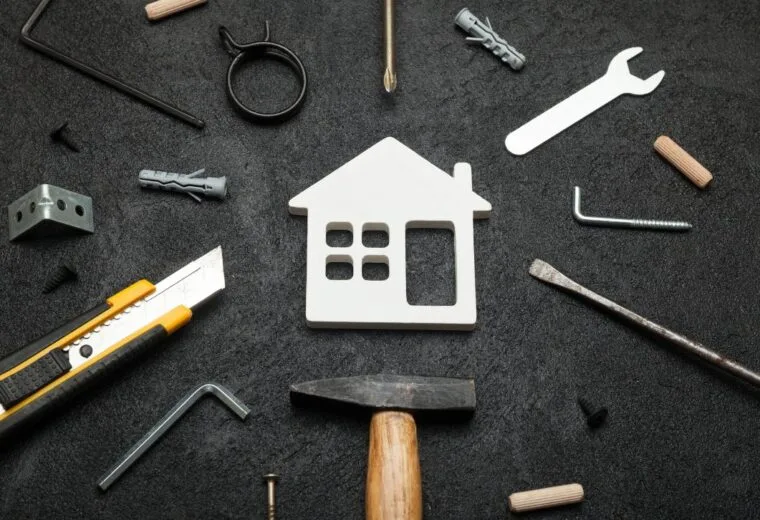 A small outline of a house surrounded by tools - Express Capital Financing
