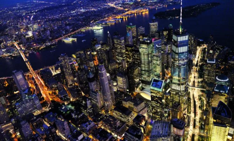 A bird's-eye view of the New York City skyline at night - Express Capital Financing