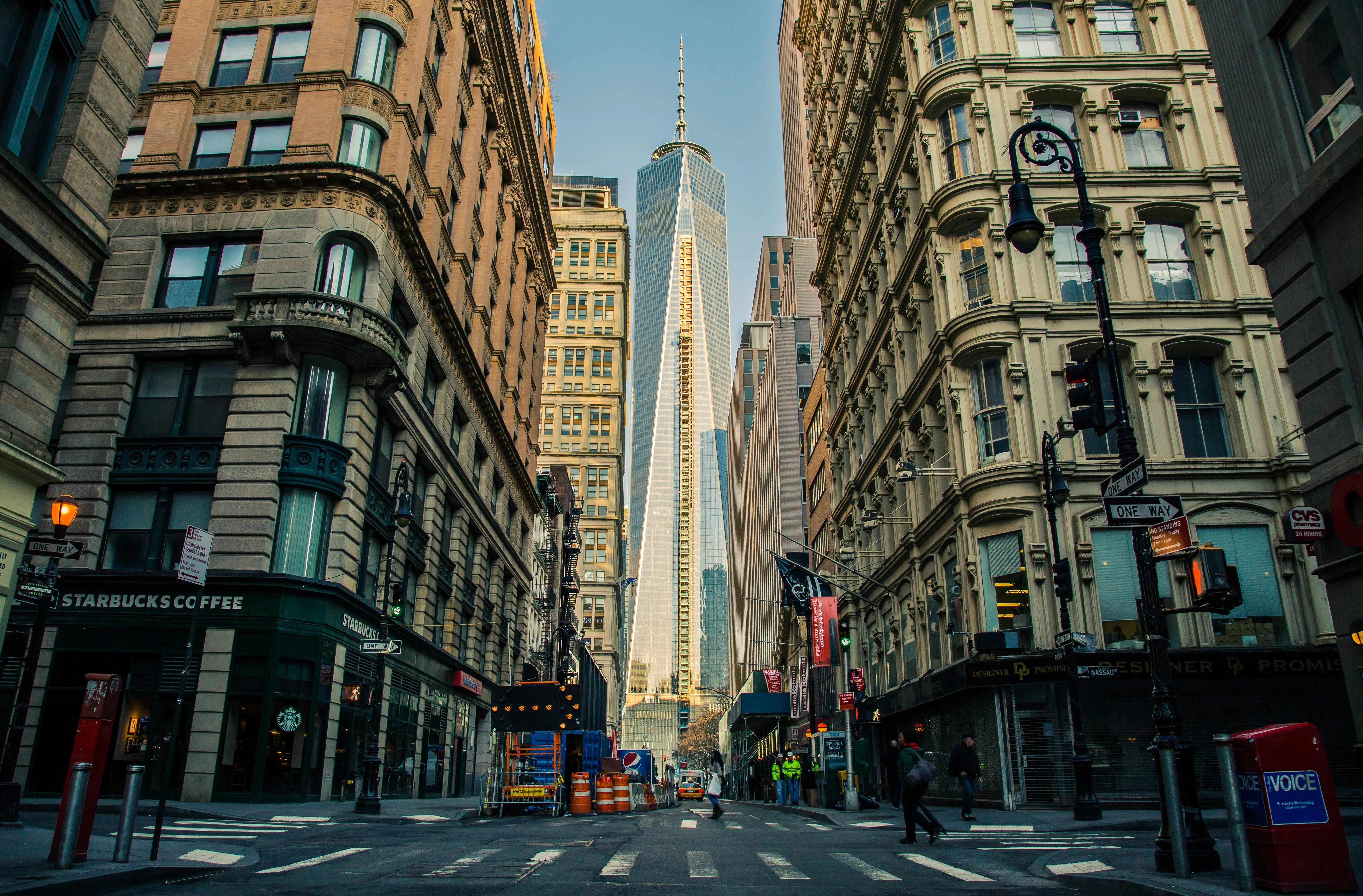 The view down a busy New York street lined with late 19th century buildings - Express Capital Financing